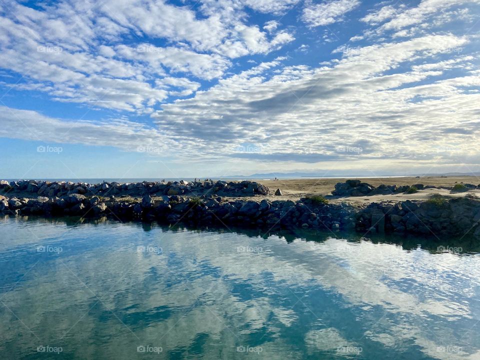 Clouds reflecting in the canal 