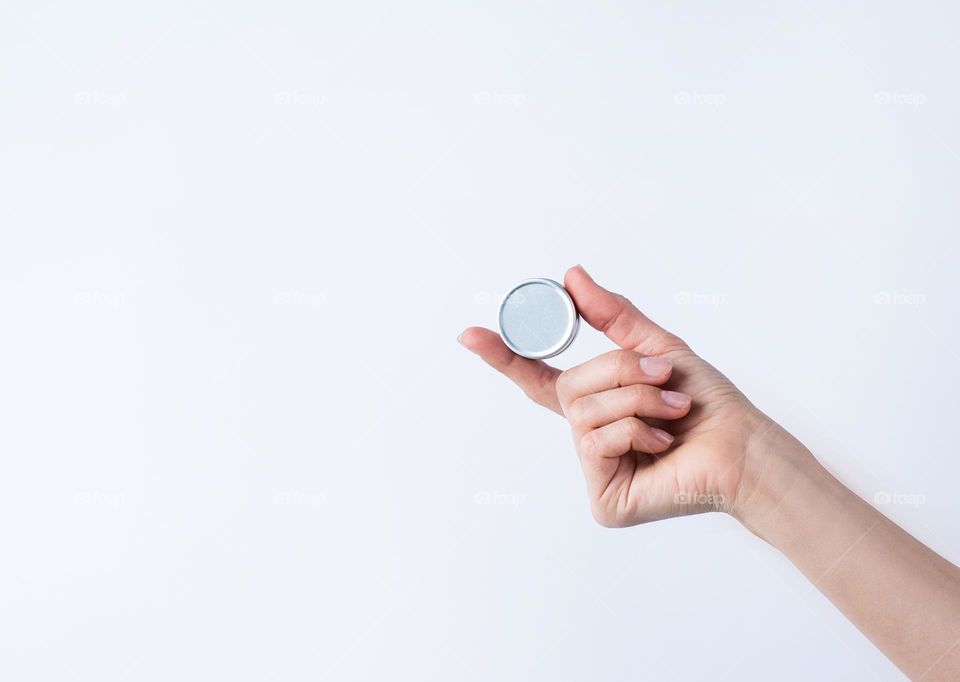 woman hands holding beauty products