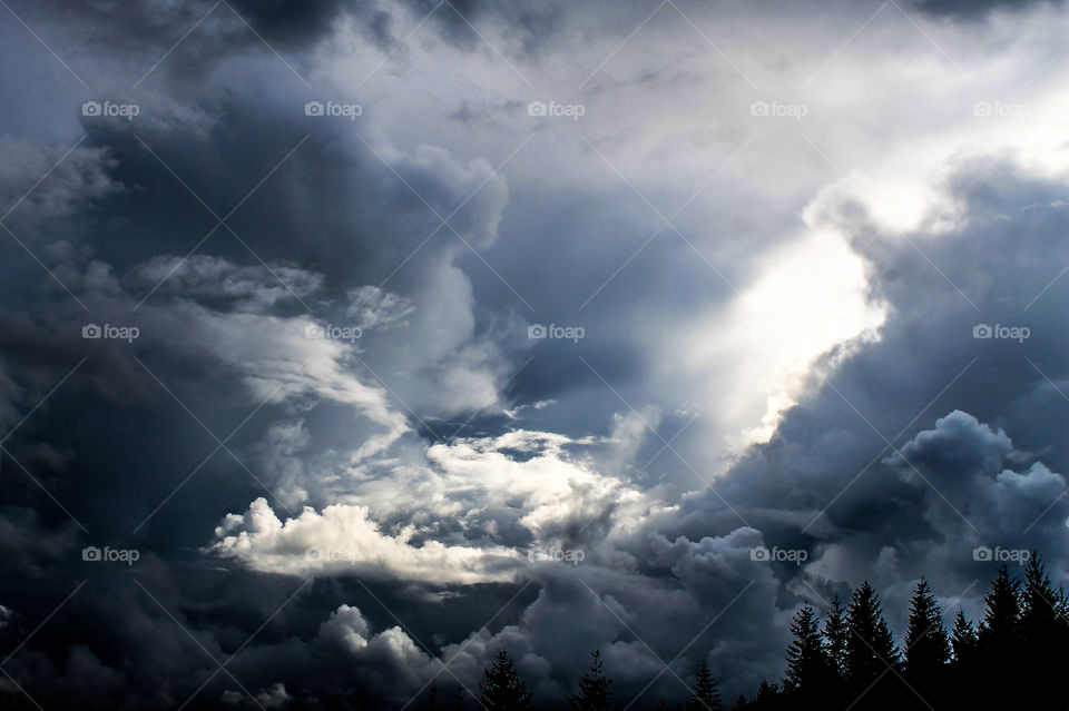 Once summer has ended, the white, fluffy wisps of clouds that float lazily on mountaintops are replaced by ominous looking, water-saturated towers ready to explode with rain & snow. But yet, the sun still manages to take a peak & shine on those below.