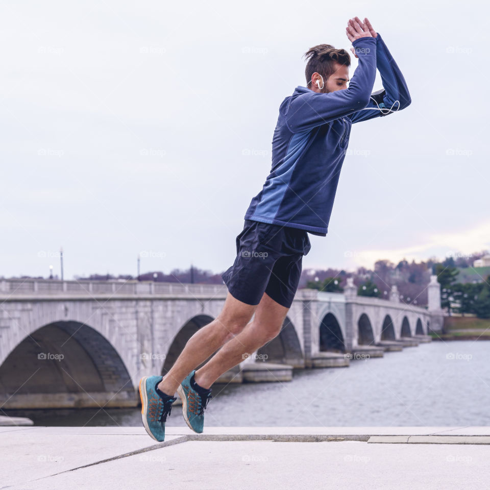 Man exercises near the Arlington Memorial Bridge 