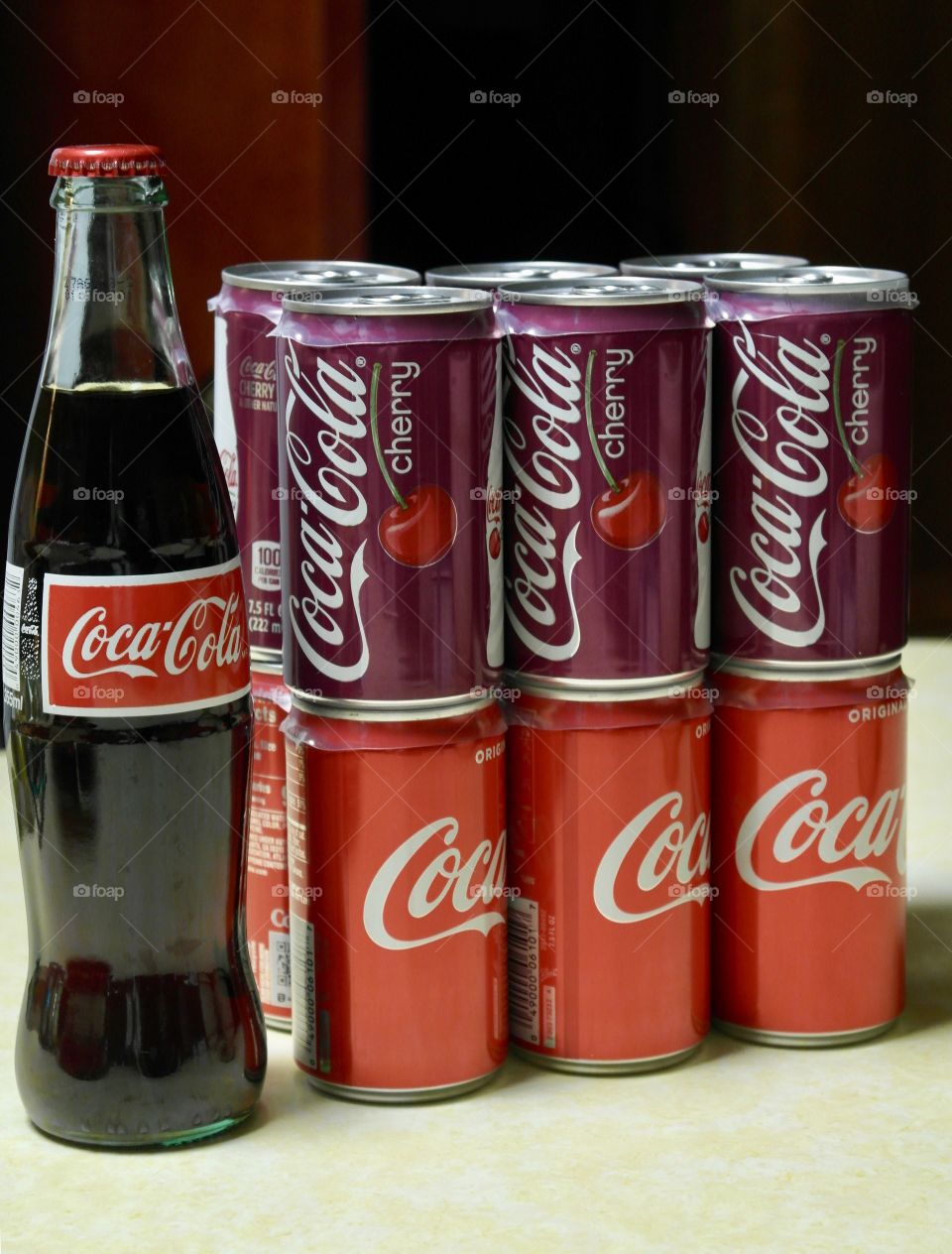 Coca Cola and cherry coke cans and bottle