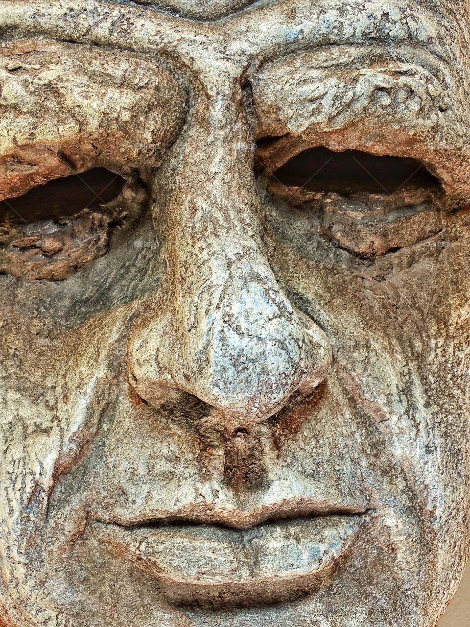 Sculpture Of Human Face. Lifelike Concrete Sculpture Of A Male Face
