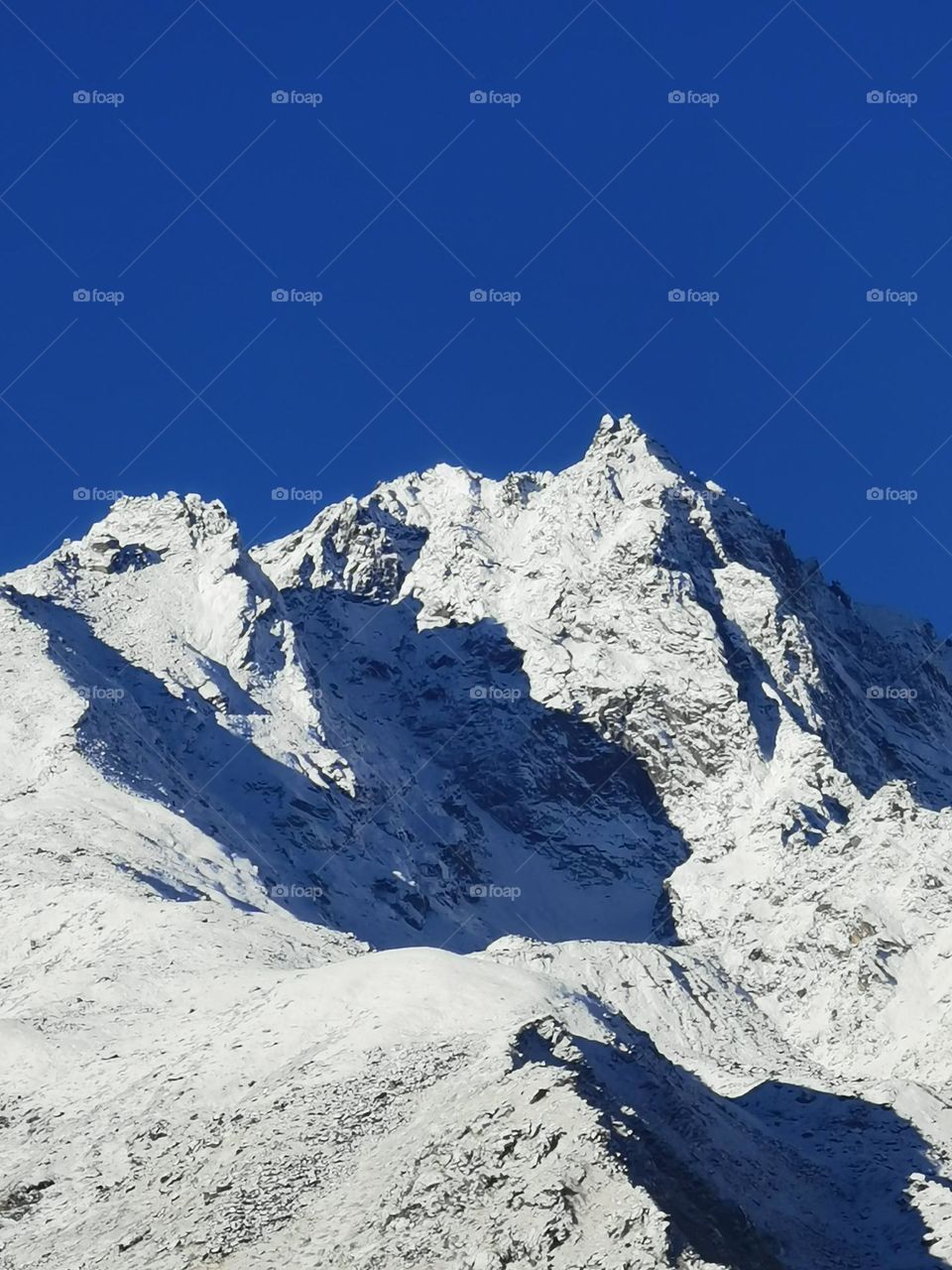 fresh snowfall on peak