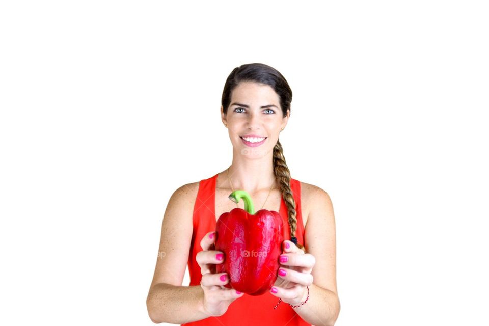 Woman with a big red bell pepper
