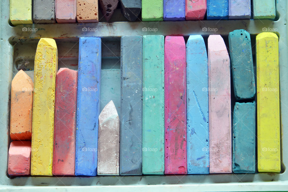 Colored chalks in a row