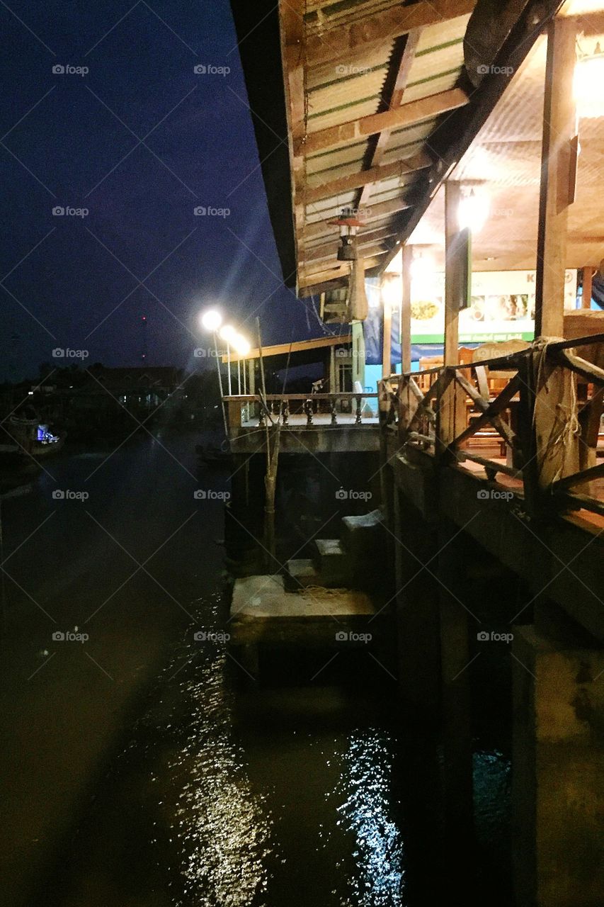 Stilt house beside river