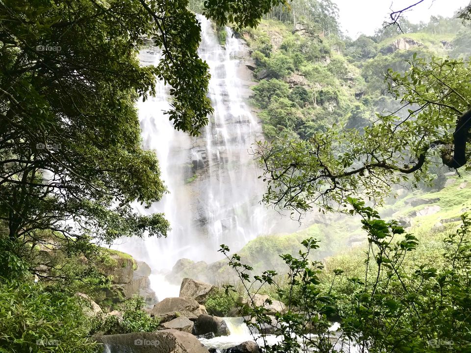 Waterfall in the mountains with mist. Bomuru Falls Sri Lanka...