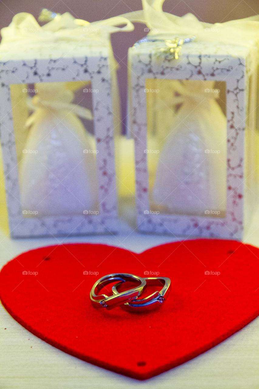 Wedding rings on red heart