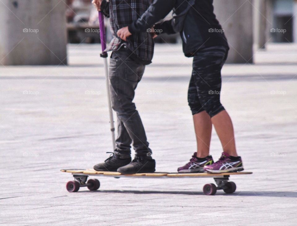 Couple on a skateboard 