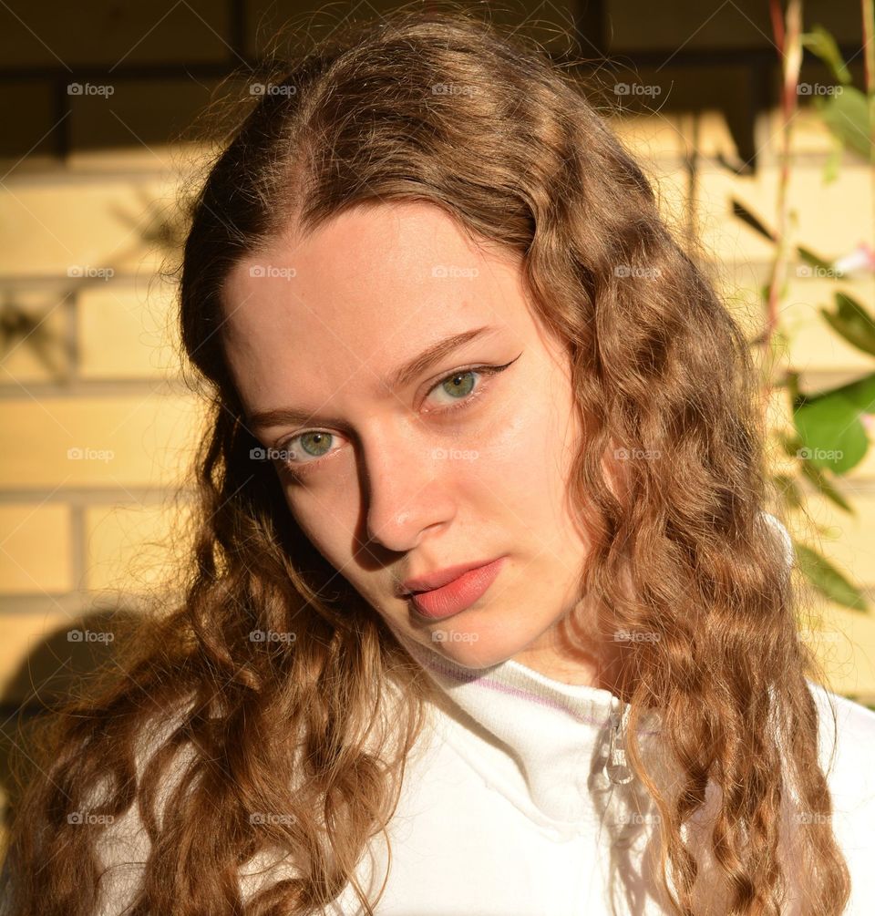 young girl beautiful portrait in sunlight