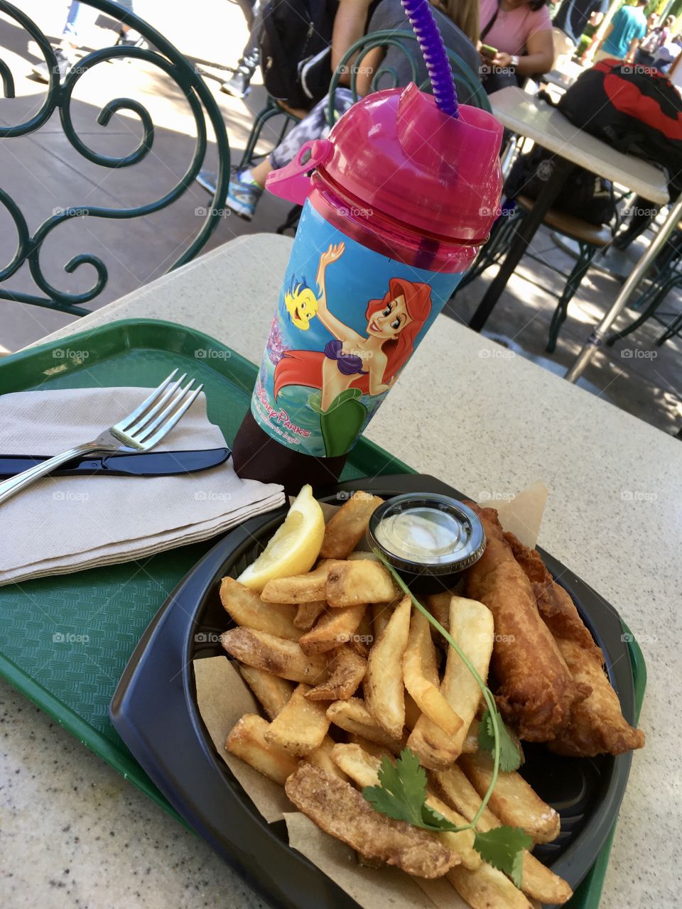 Ariel cup, fish and chips eating outside in Disney California Adventure.
