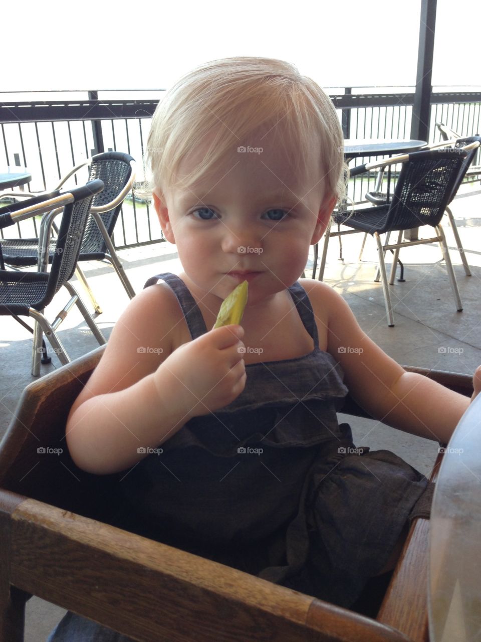 Toddler eating a pickle 