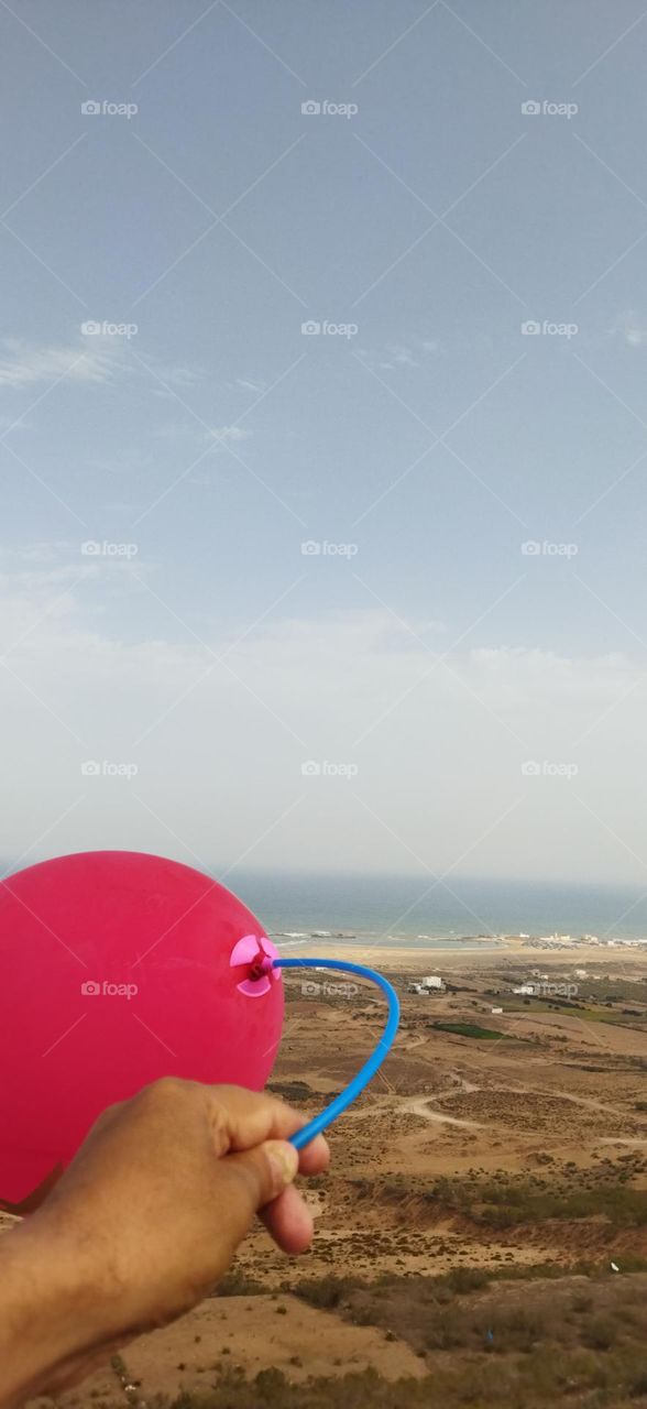 Splendid red ballon and fantastic view to sea.