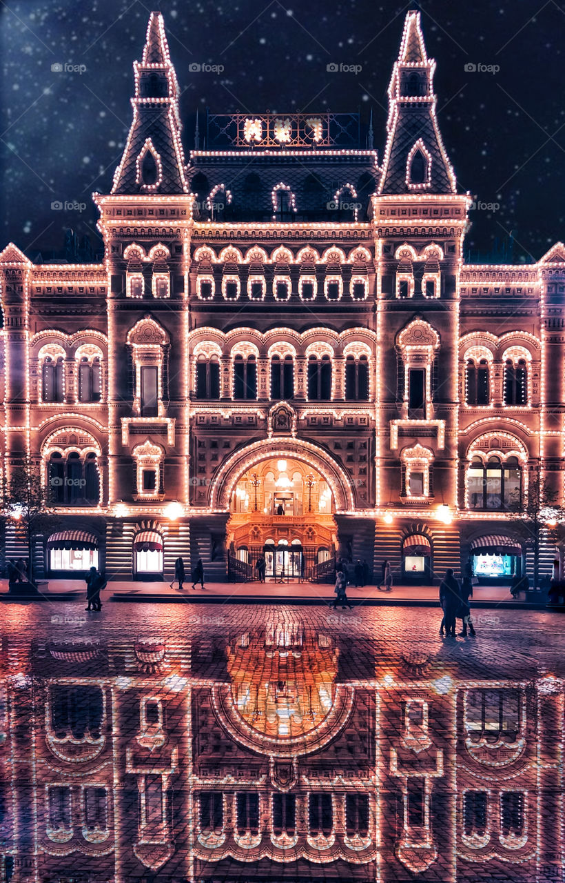 Building illuminated in the square