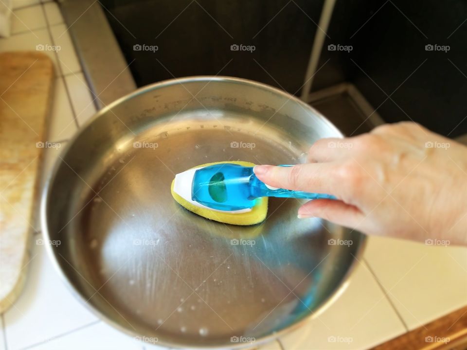 Handy Woman Washing a Pan