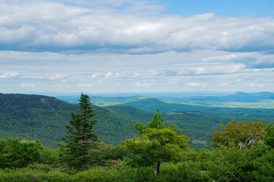 A beautiful view from the top of Miller State Park. Glancing over the mountains, hills, and forests of New Hampshire.