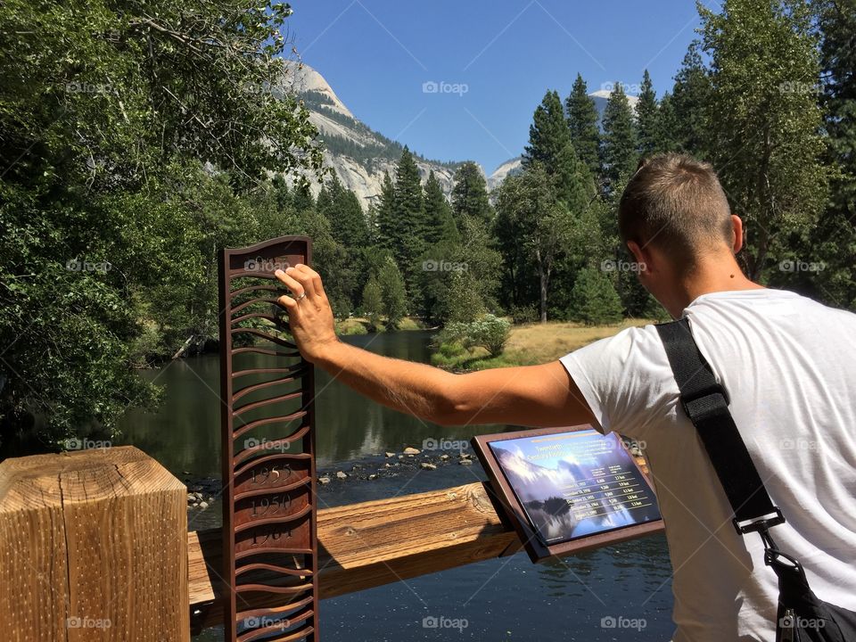 Man reading the map in a beautiful place