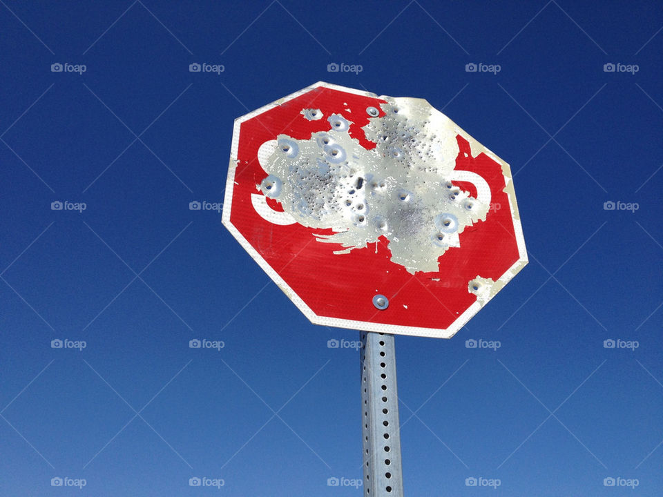 sign flying stop nevada by slls