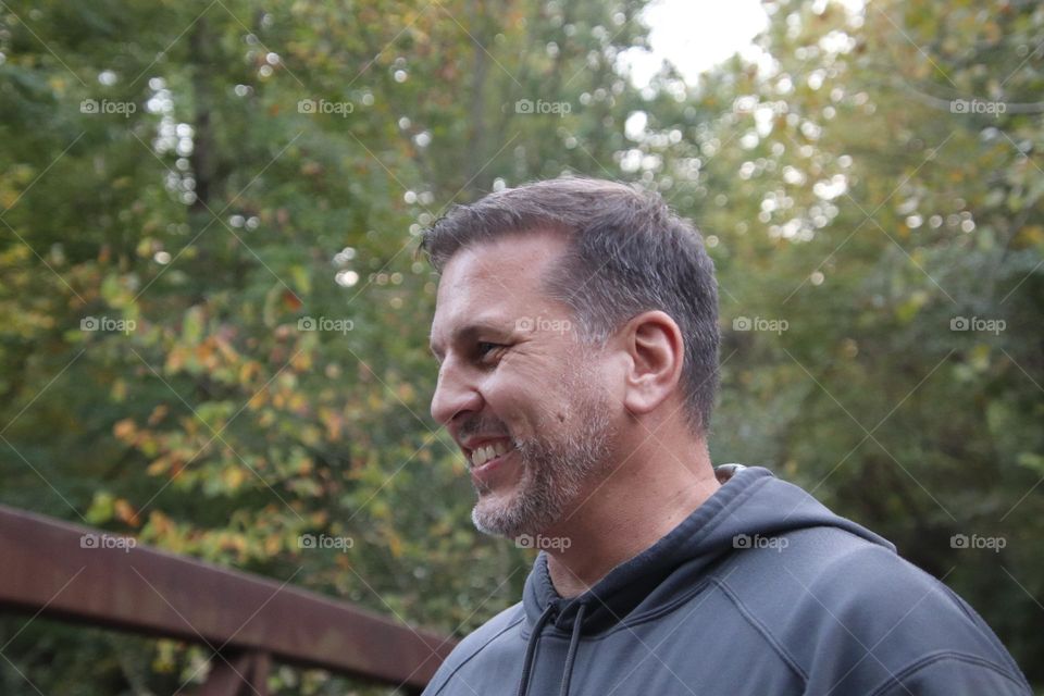 Handsome smiling man with natural background