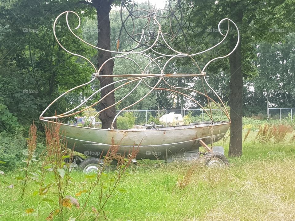 A sloop,  on a field for decoration.