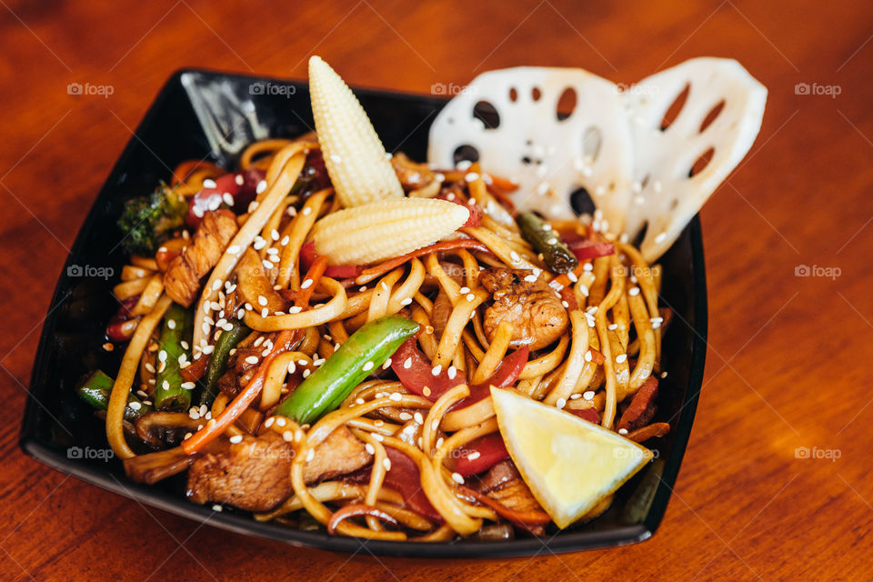 Tasty food on wooden table