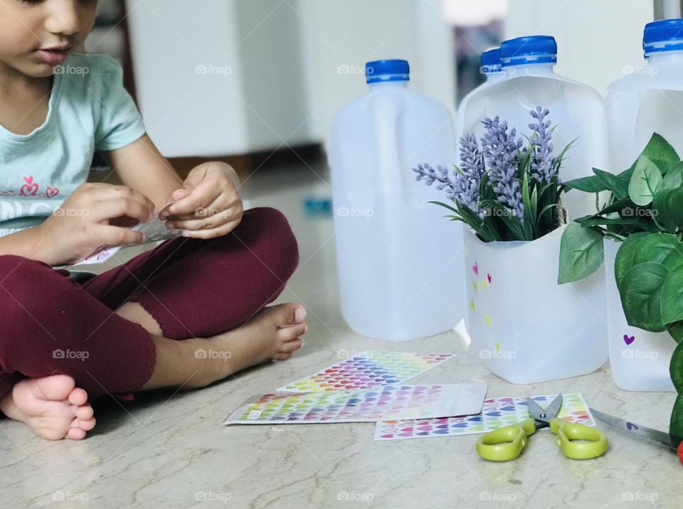 Craft with leftover plastic milk bottles made kids engaged with it.