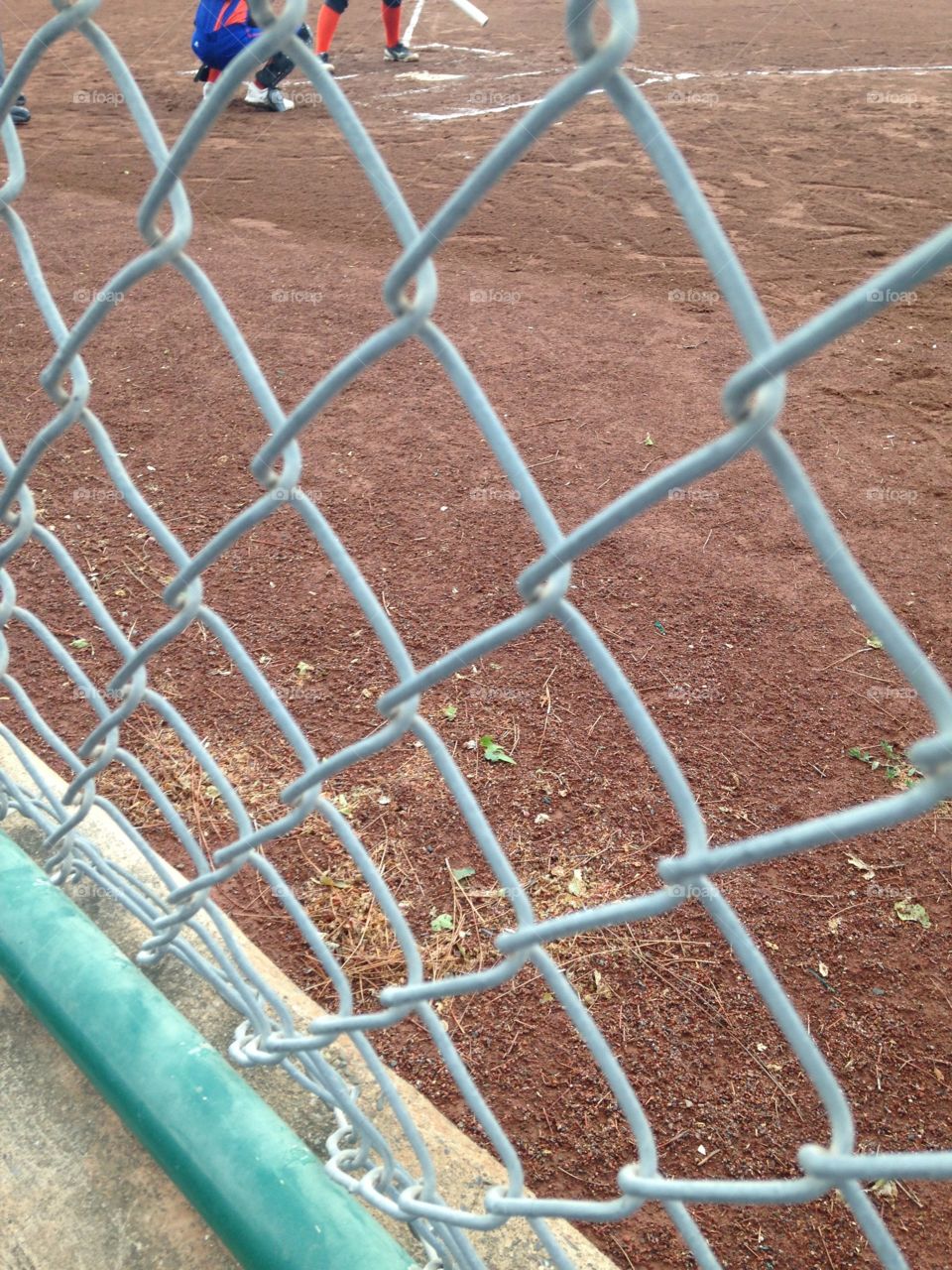 Chain link . Soft ball field where my sister plays 