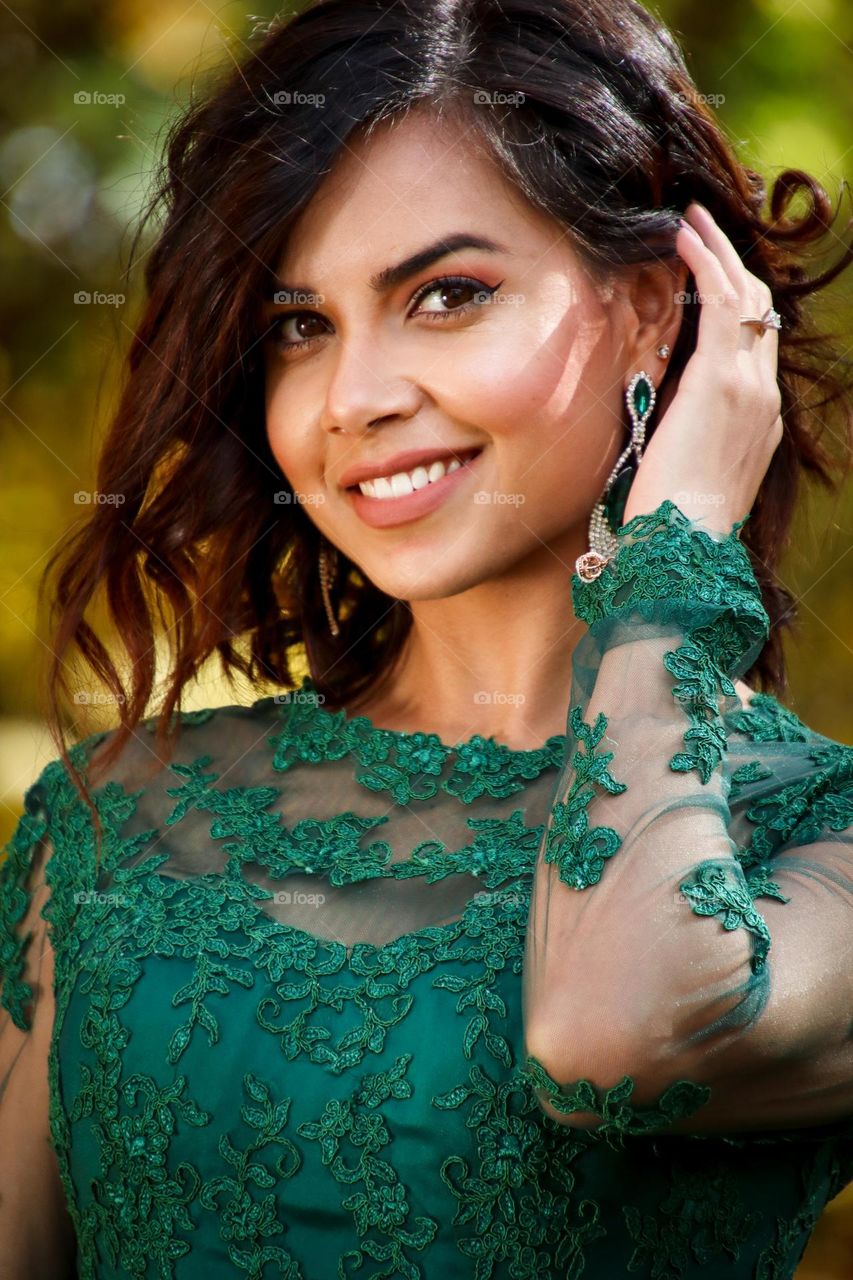 Beautiful smiling Afghani woman in green