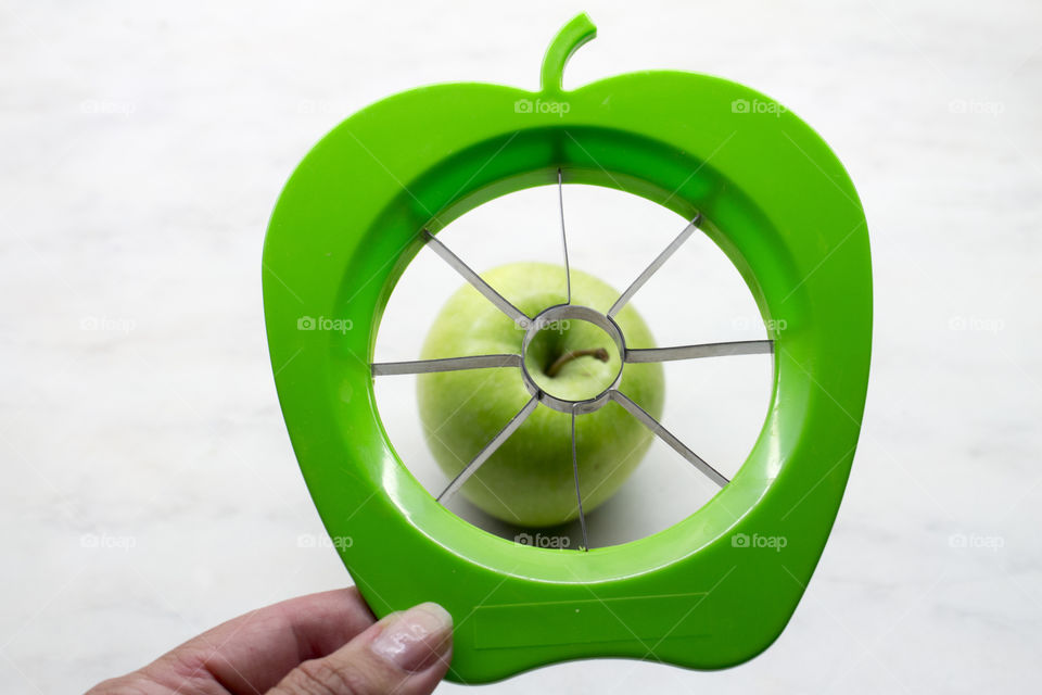 Green apple slicer and a green apple 