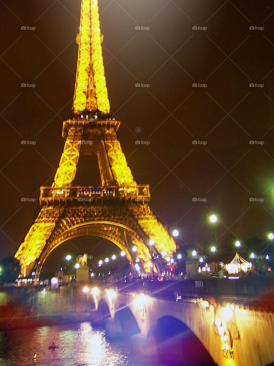 Eiffel Tower at night during laser show; Paris, France