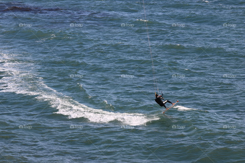 Kitesurfer carried by the winds 