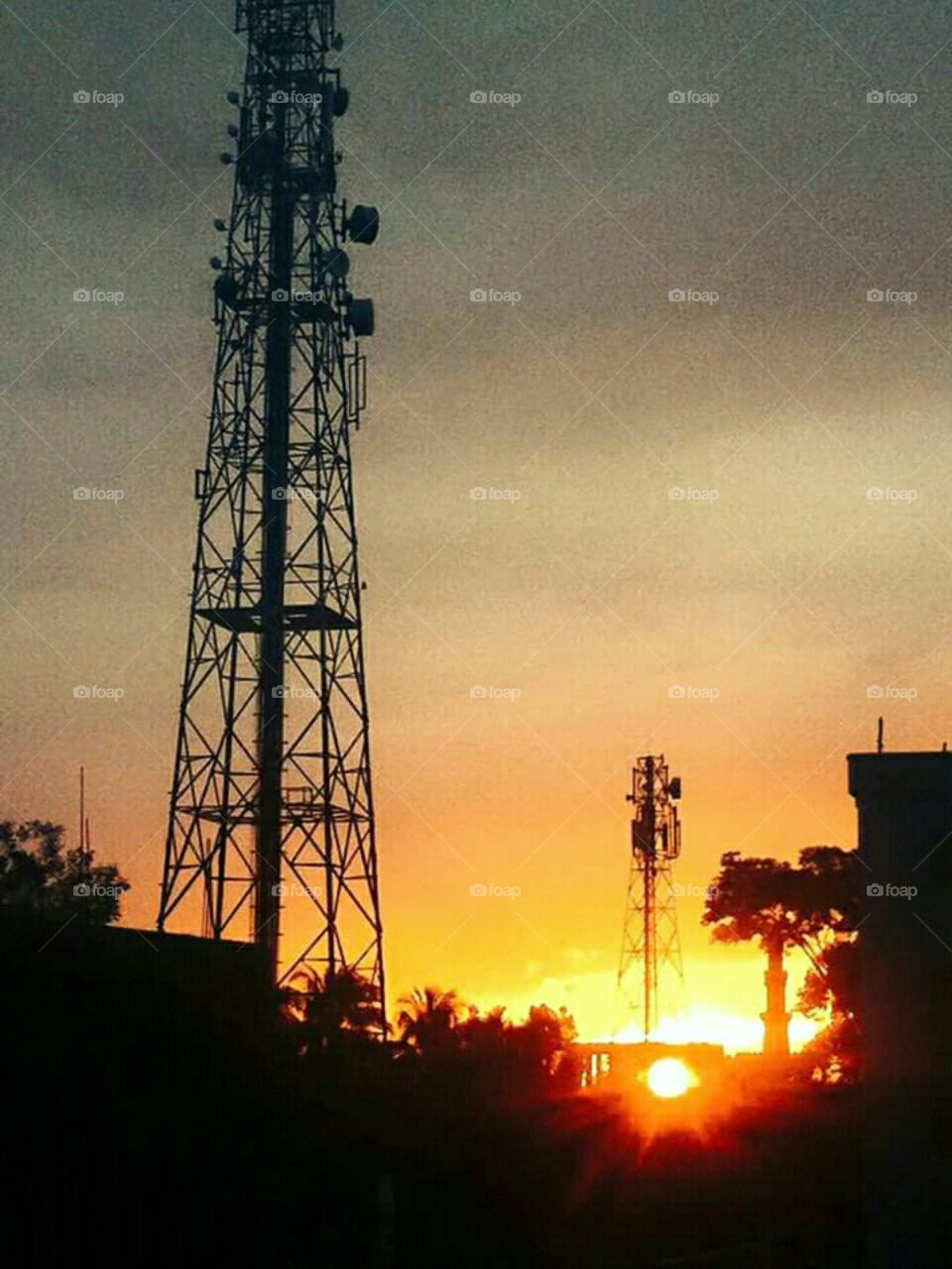 sun set beside tower