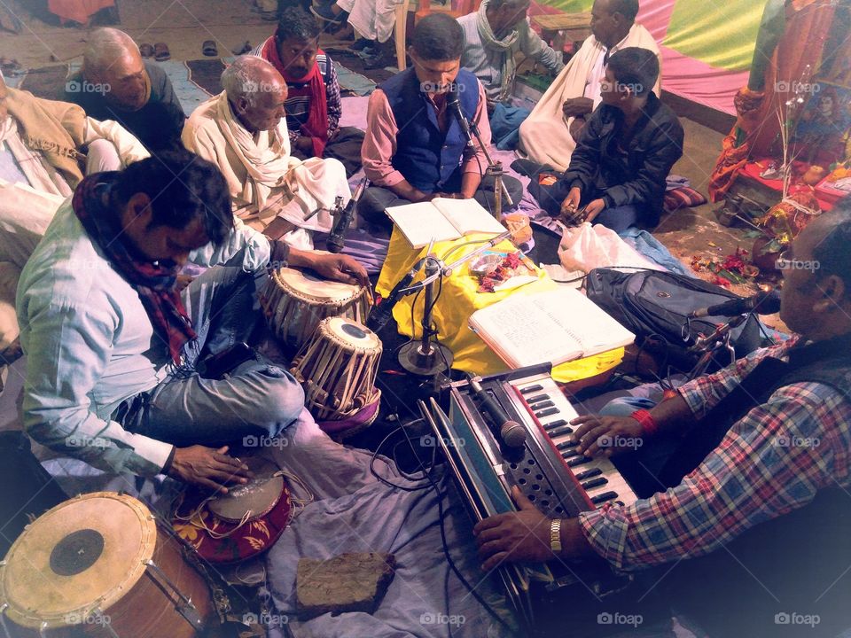 A man playing tabla harmonium