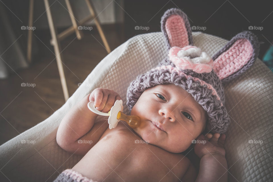 Cute baby in rabbit costume