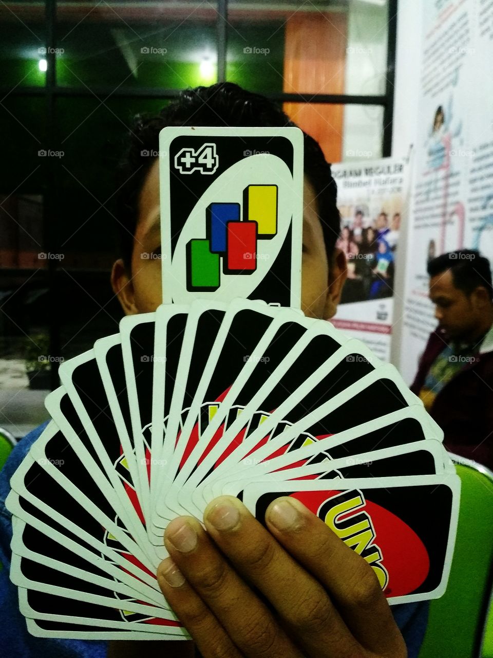 filling free time and looking busy with playing uno card