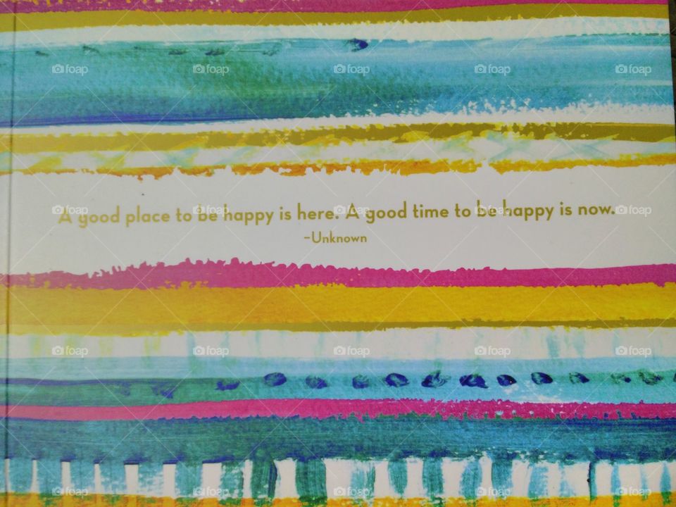 a brightly colored journal dispenses advice on being happy