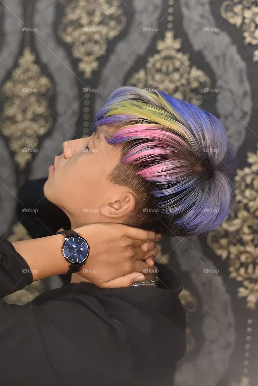 Beautifull Rainbow Colored and Smooth Hair of The Good Looking Model with A Fresh New Haircut