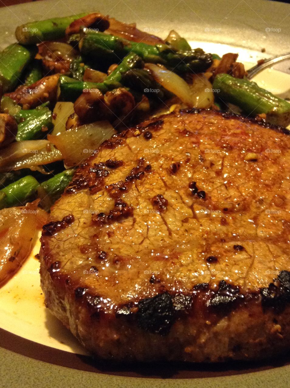 Close up before chowing down. Beef steak with a side of vegetables.