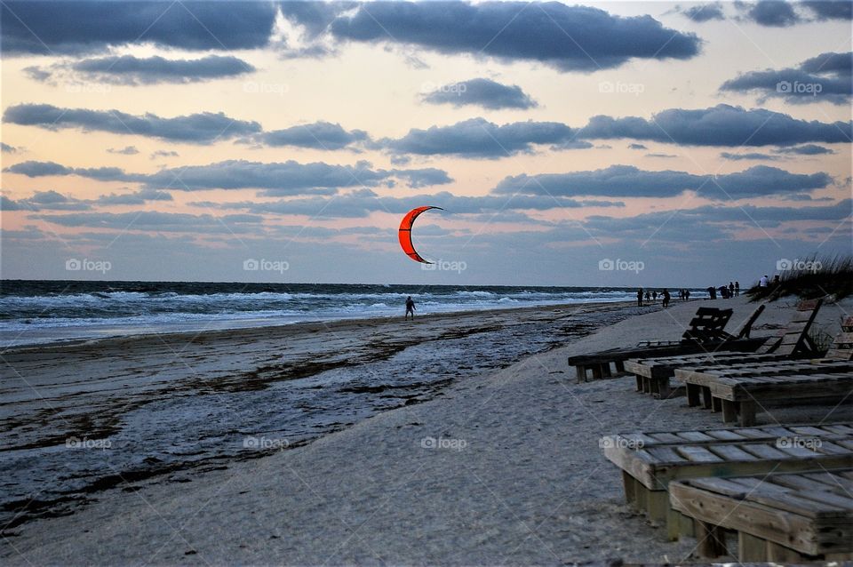 Kiteboarding along the beach