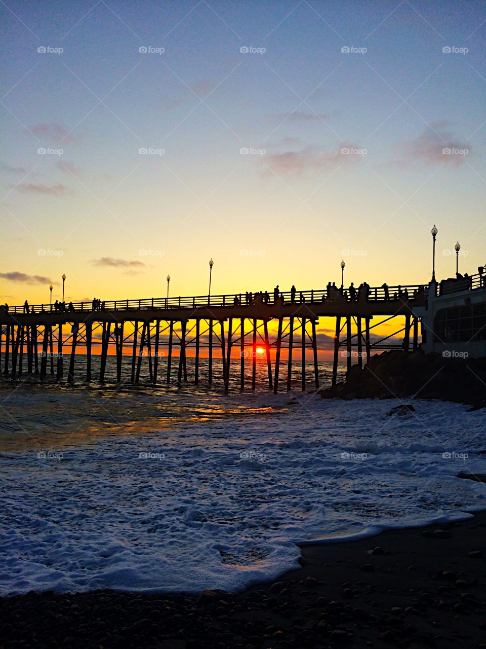 Silhouette of people on pier