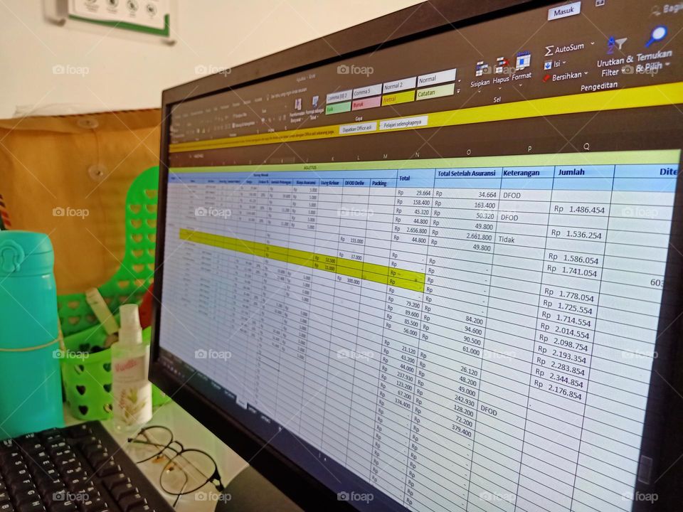 Inputting sales data in online business via laptop