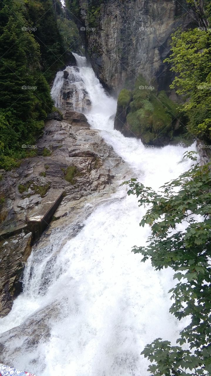 waterfall, cascade waterfall, waterfall at city, city Bad Gastein, Austria