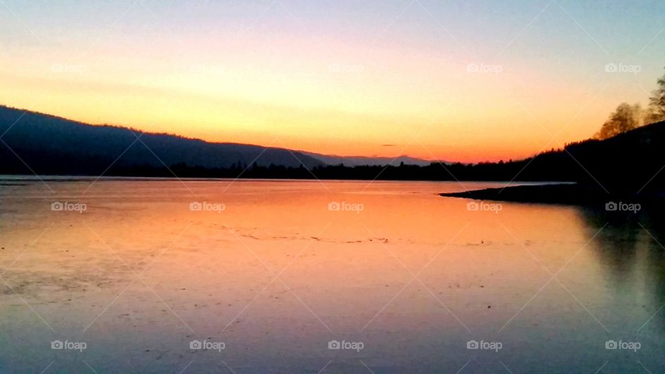 Sunset reflected on lake ice