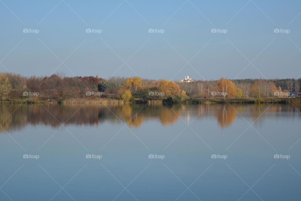 lake beautiful nature landscape and reflection autumn time blue sky background, no filters