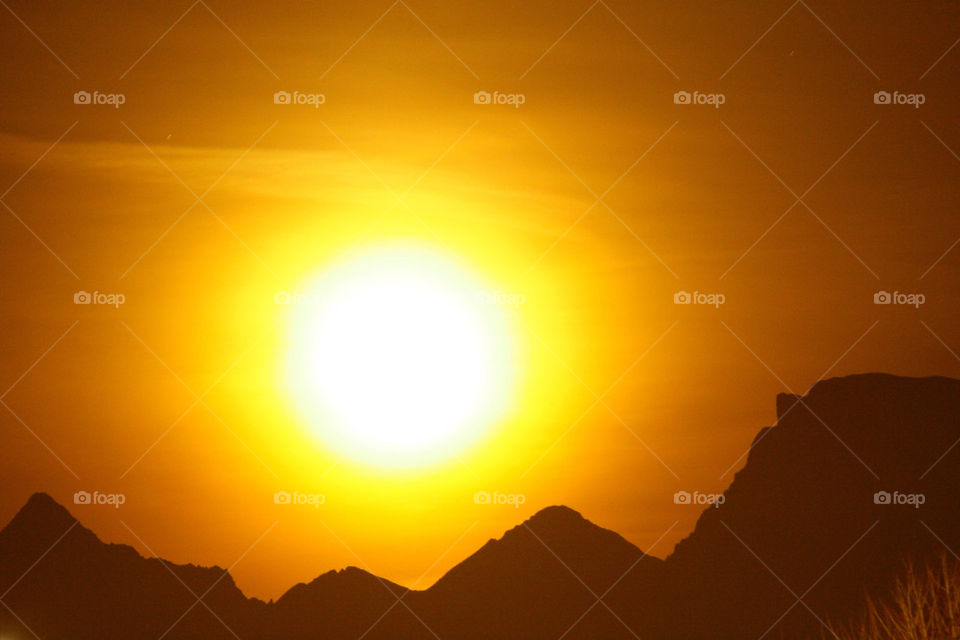 Dramatic sky and silhouette of mountain