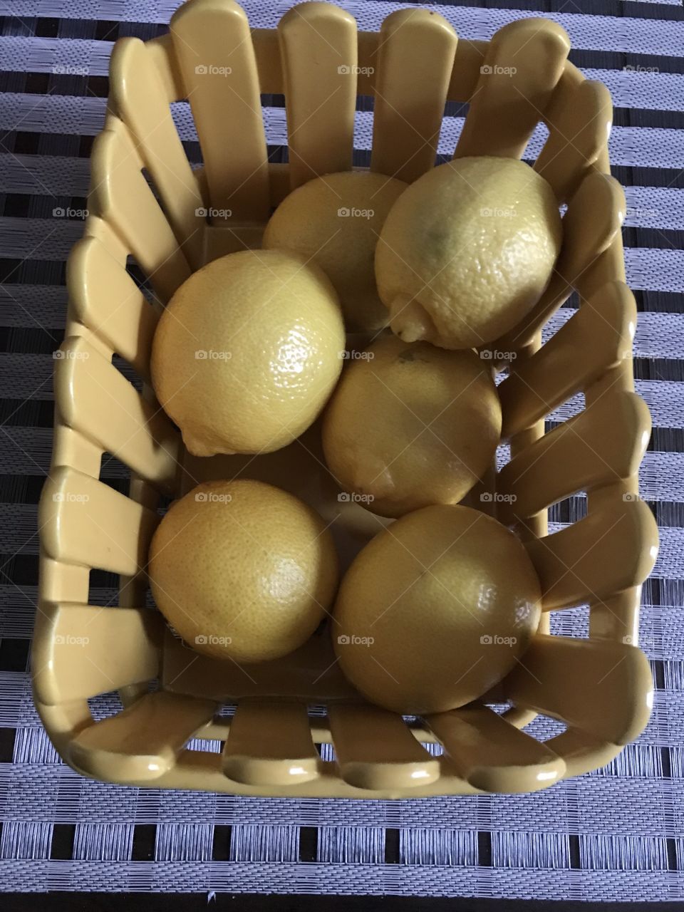 Lemons in yellow basket