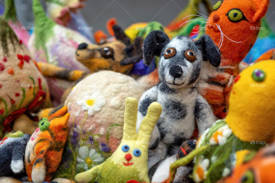 Various homemade soft felted toys on the market.