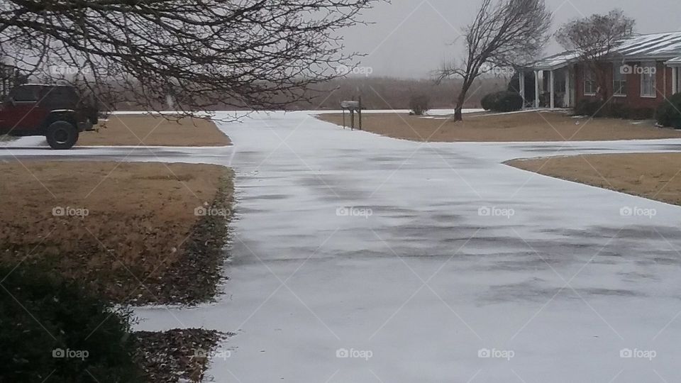 Snow upon the driveway.