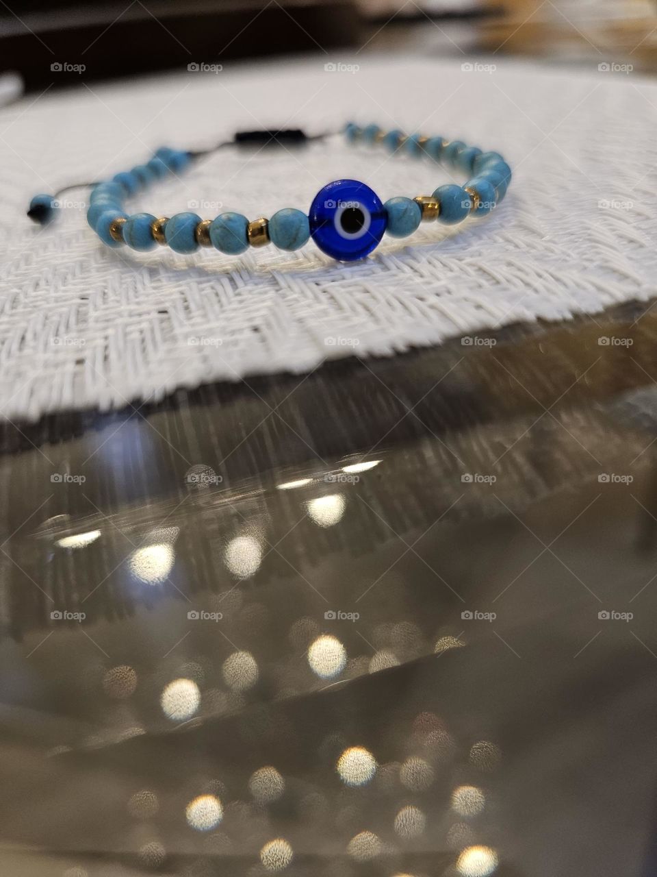 Blue bracelet on table