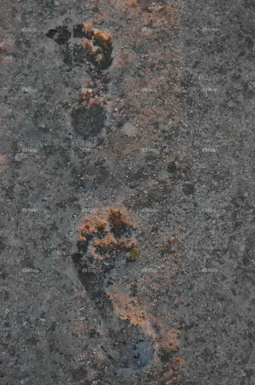 Footsteps in concrete